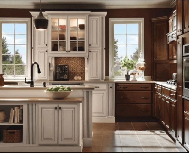 Homecrest Kitchen Cabinets Both Light and Dark With Multi Level Island With Sink in the Middle