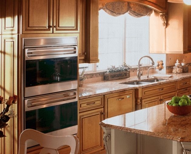 Omega Kitchen Cabinets In Bright Kitchen With Kitchen Island and Oven