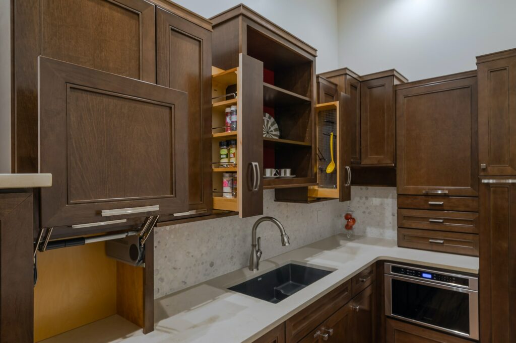 image of a showroom kitchen area with a sink and cabinets